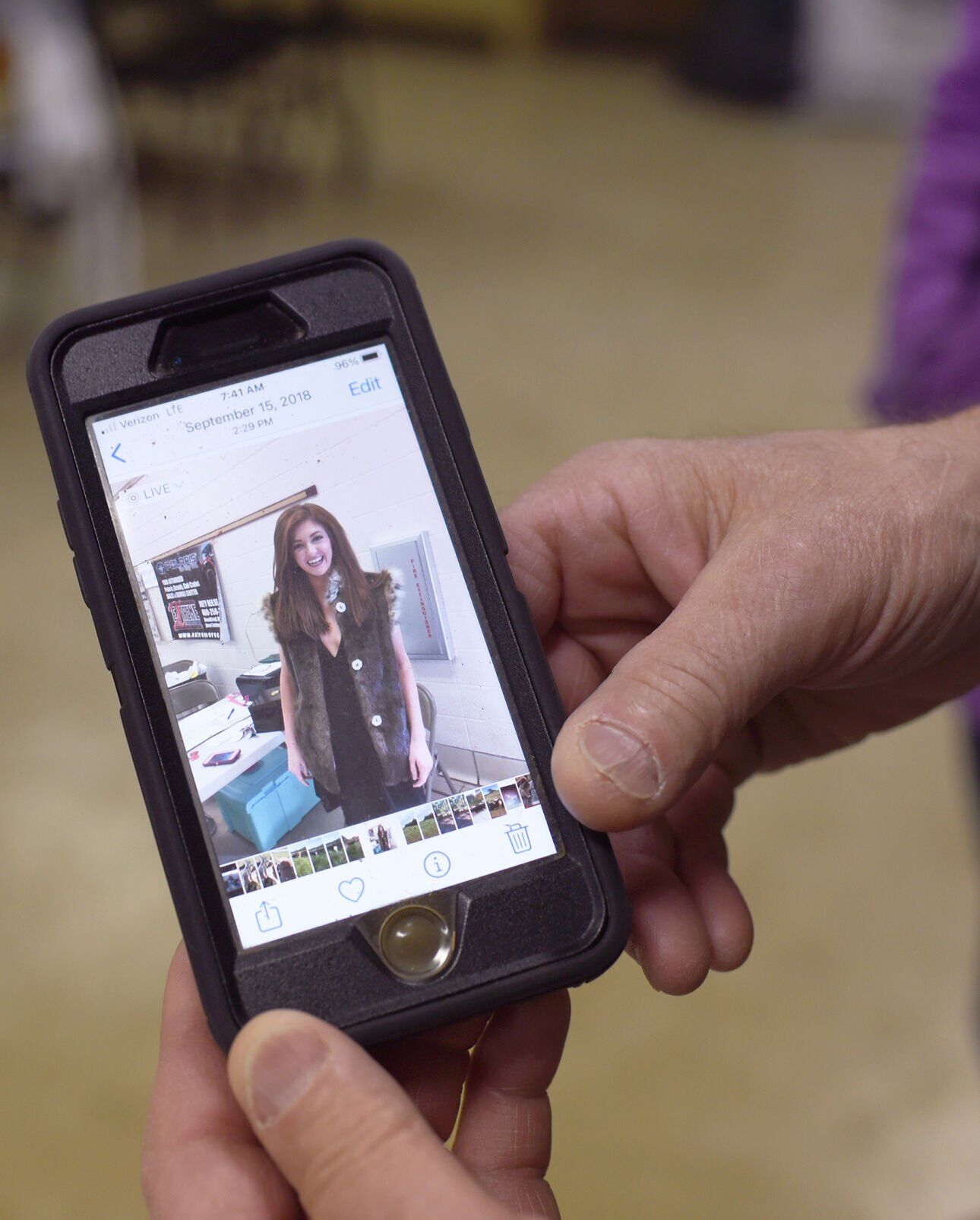 Mike Naeger holds his phone displaying a photo of Miss Missouri 2018 Katelyn Lewis.